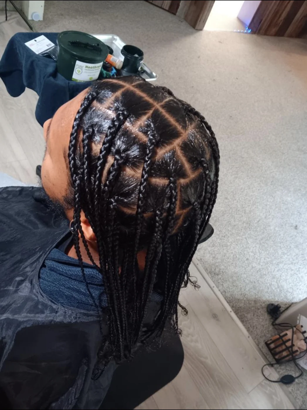 Top view of a braided protective style with precision parting by Elegant African Braiding
