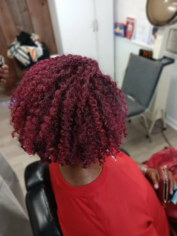 Short burgundy crochet curl style created by Elegant African Braiding