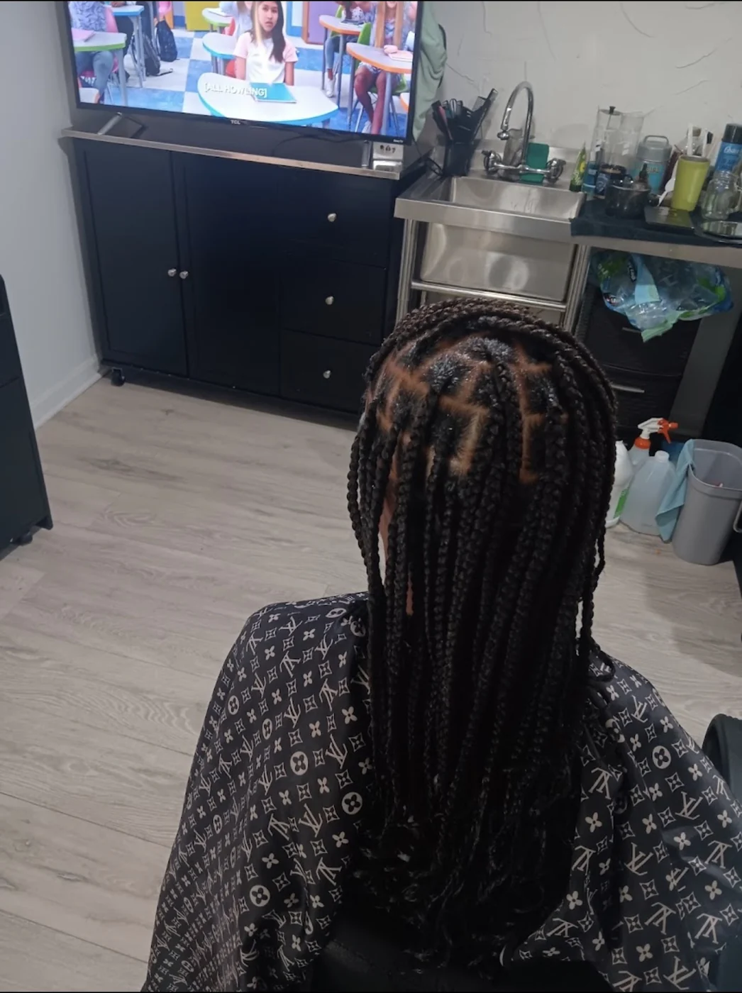Back view of medium braids created by Elegant African Braiding